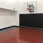 POH197_Lino Lakes_light gray and cardinal metallic floor coating Twin Cities Spring Parade of Homes #197 indoor basketball court featuring epoxy floor coating installed by Millz House