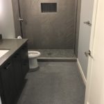 Bathroom with Epoxy Floor Lower Level Bathroom with epoxy floor coating installed by Millz House