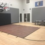 Indoor basketball court in Edina MN with SnapSports flooring in light and dark maple