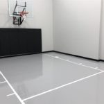 Twin Cities Spring Parade of Homes #33 indoor basketball court with epoxy floor coating installed by Millz House