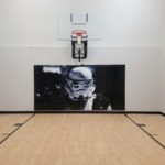 Millz House / SnapSports MN installed indoor basketball court featuring Star Walls Wall Pad
